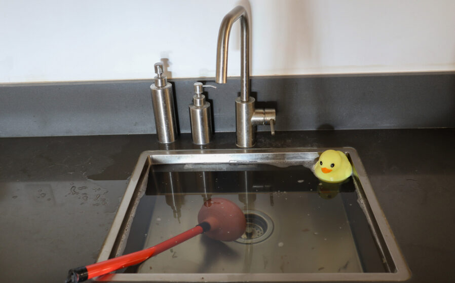 Overflowing,Kitchen,Sink,,Clogged,Drain.,Plunger,(force,Cup),And,Yellow